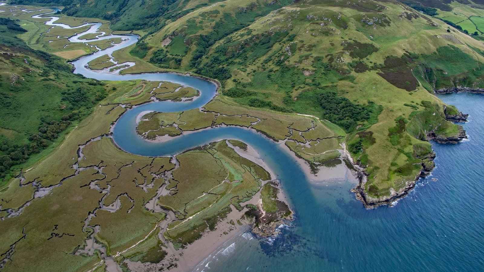 RIA NYT crossword answer to 'Coastal inlet' clue — aerial view of a drowned river valley coastline